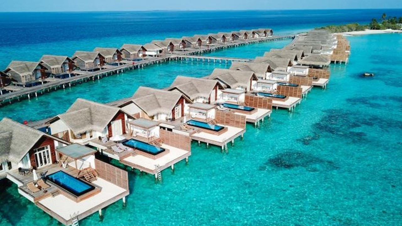 Outside Living-in at Fairmont Maldives' Grand Water Sunset Villa